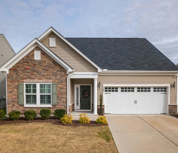 A welcoming suburban family house with a modern facade, perfect for residential living.